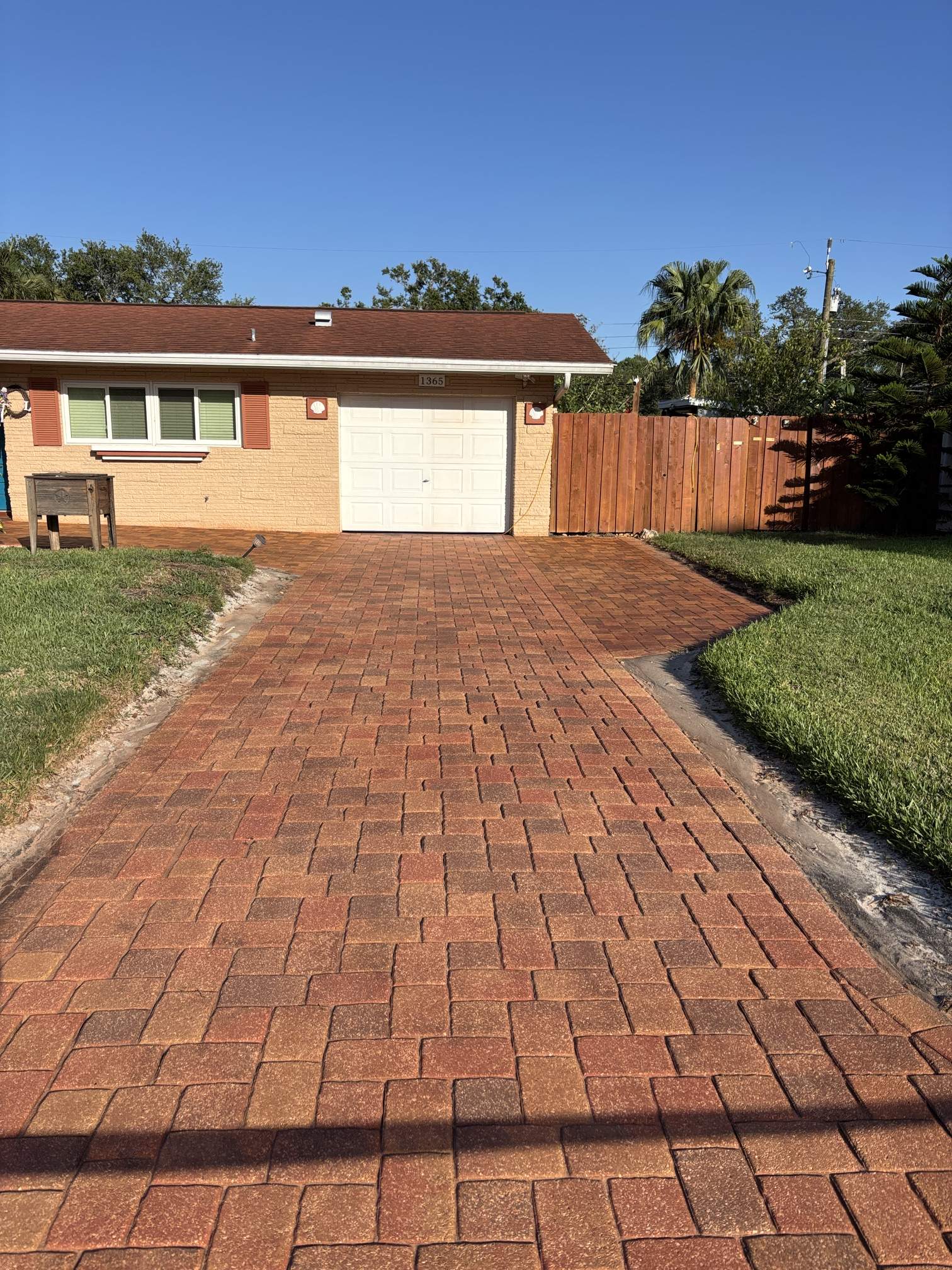 Low-angle close-up of Brick Red paver stain and sealing in Clearwater, FL