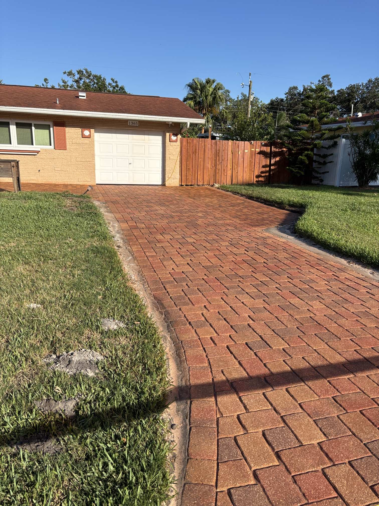 Driveway after Brick Red paver stain and sealing, side angle view, Clearwater, FL