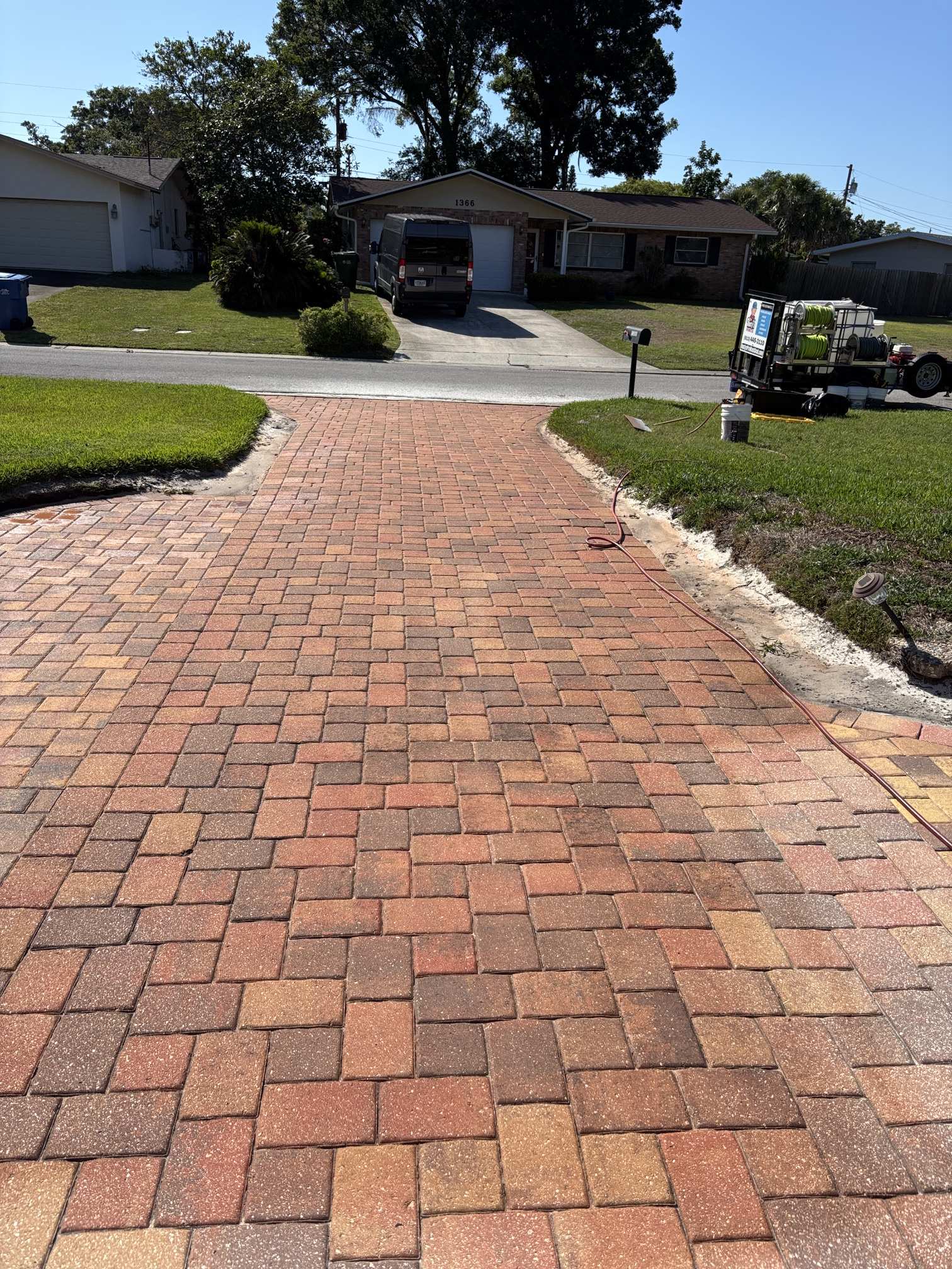 Street view of a faded paver driveway before paver cleaning and tinting in Clearwater, FL