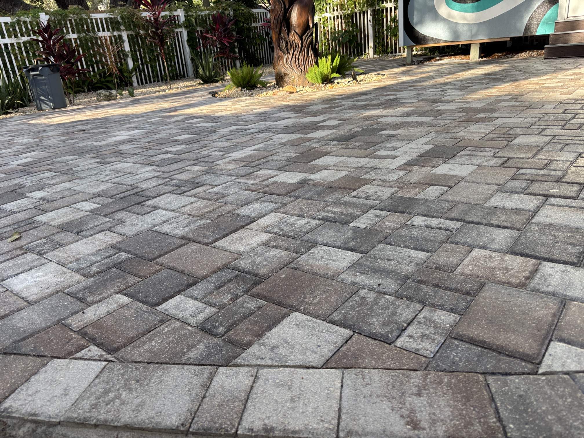 Rusty's Pro Wash & Seal technician performing paver patio cleaning and sealing in Clearwater, FL