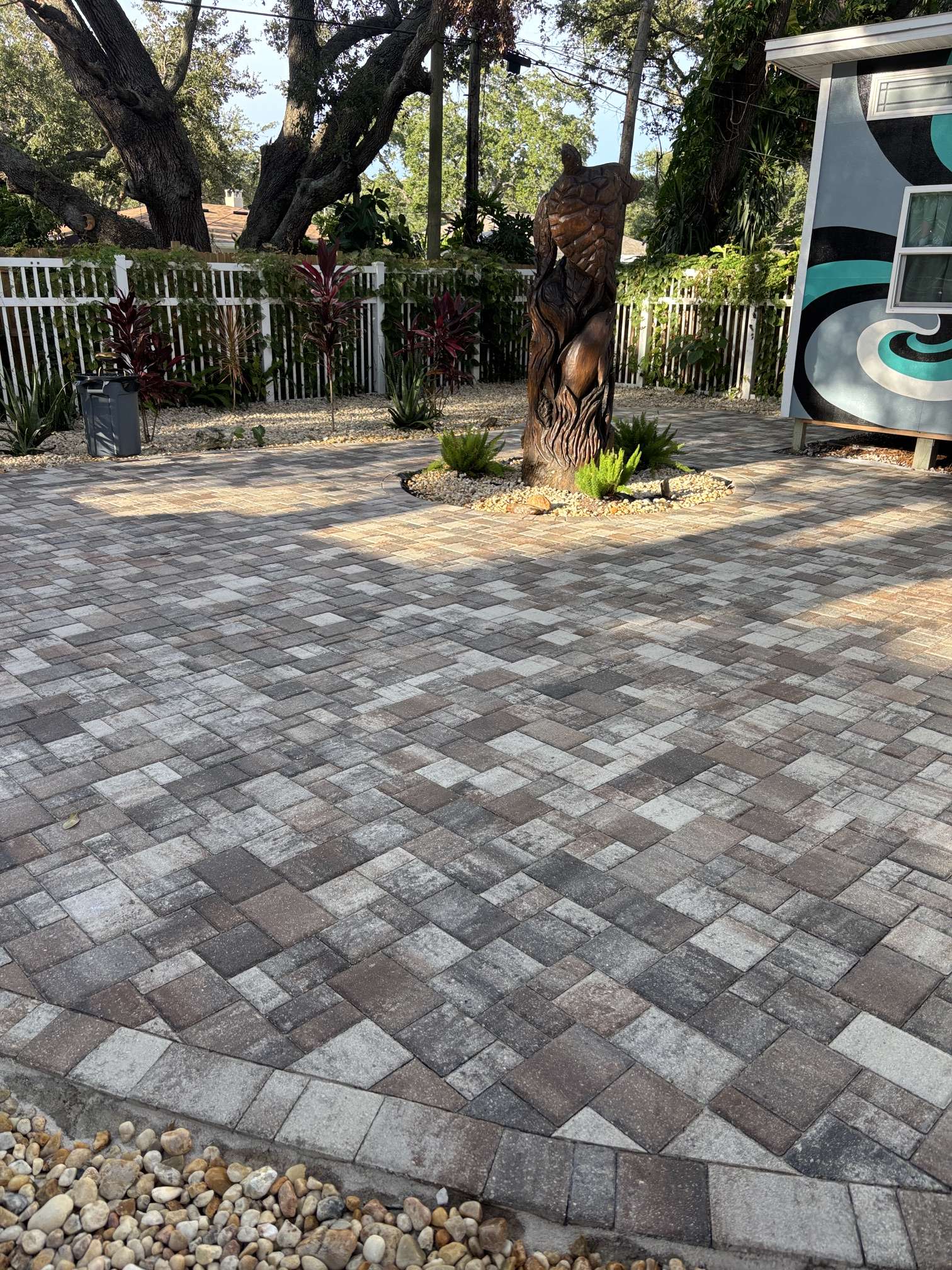 Wide view of a completed paver patio cleaning and sealing project in Clearwater, FL, near the water