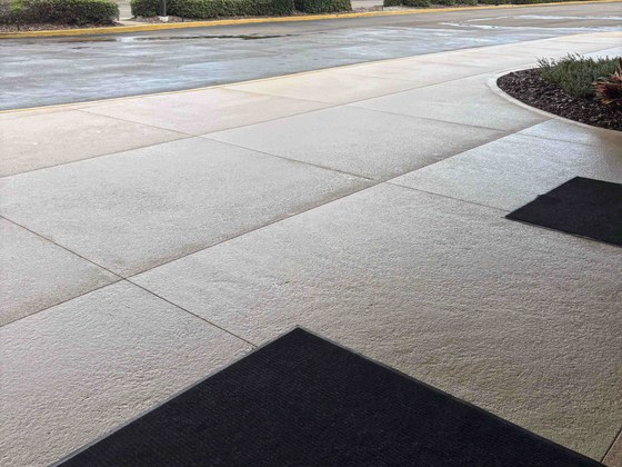 Covered entryway painted concrete soft wash at commercial building in Feather Sound, Clearwater, FL