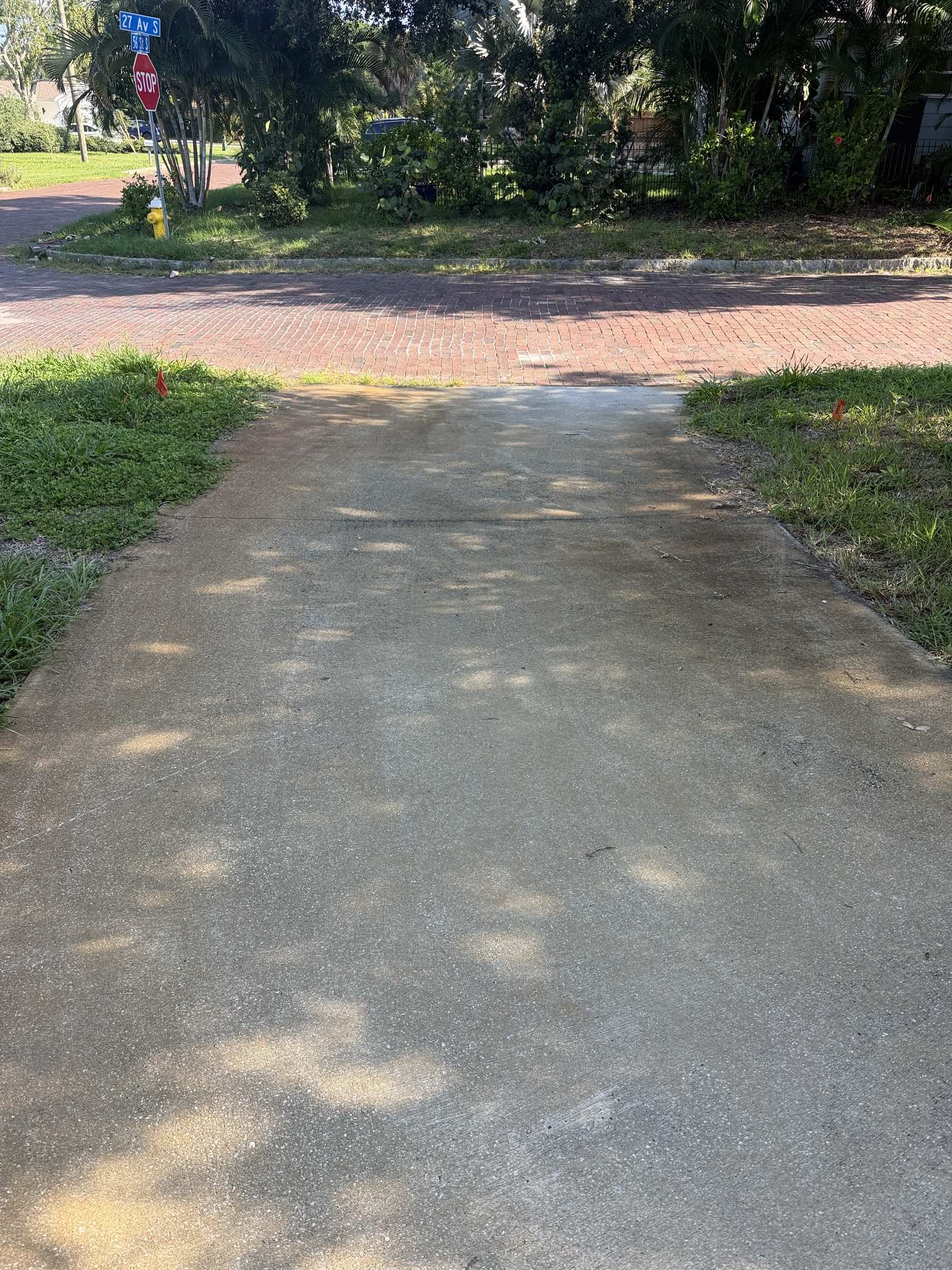 Before rust removal on a wide driveway view in Gulfport, FL, near St. Petersburg