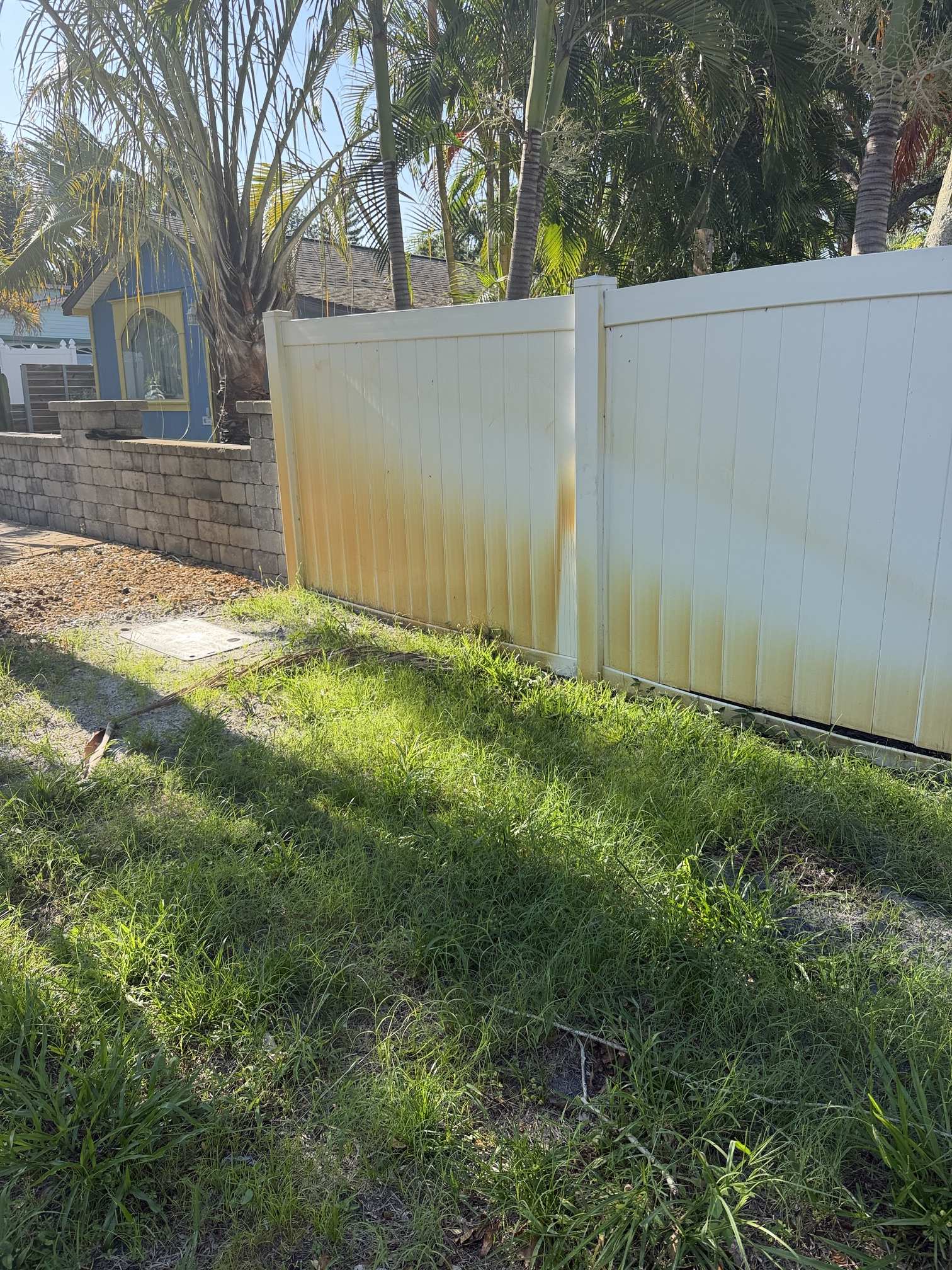 Before photo of vinyl fence rust staining in Gulfport, FL