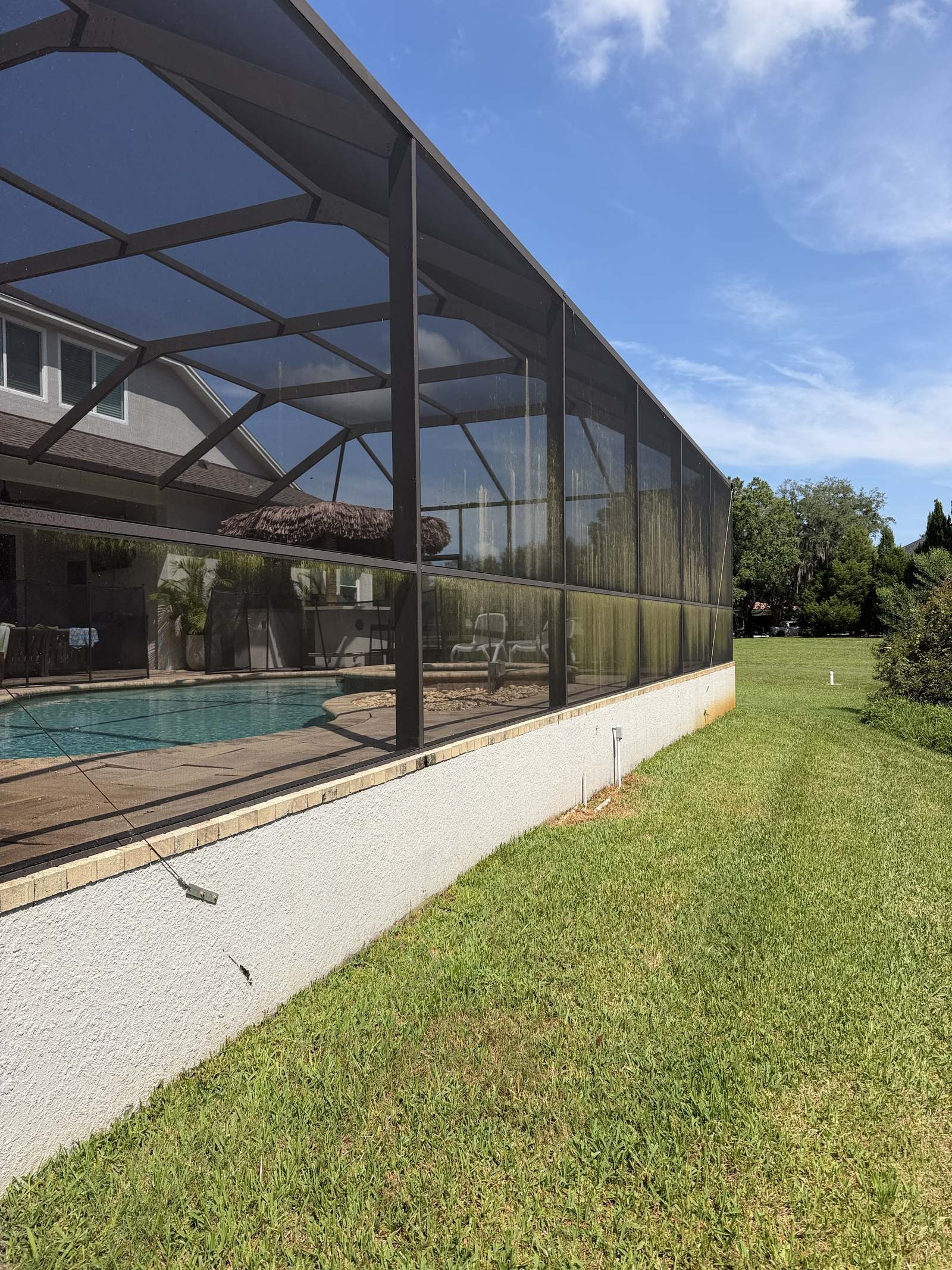 Before photo of pool cage screen enclosure in Lutz, FL