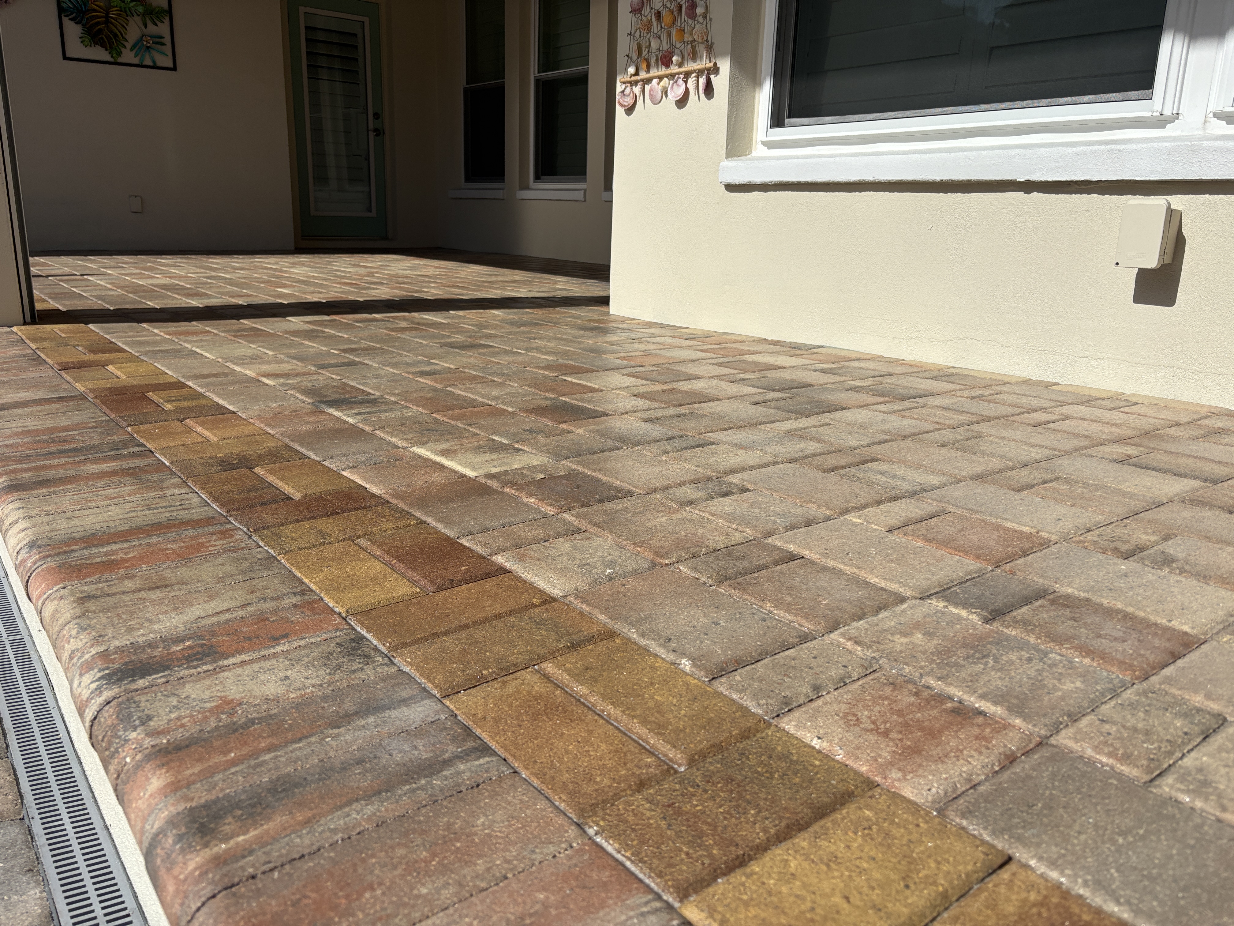 Pool deck pavers in Largo, FL sealed with a gloss finish