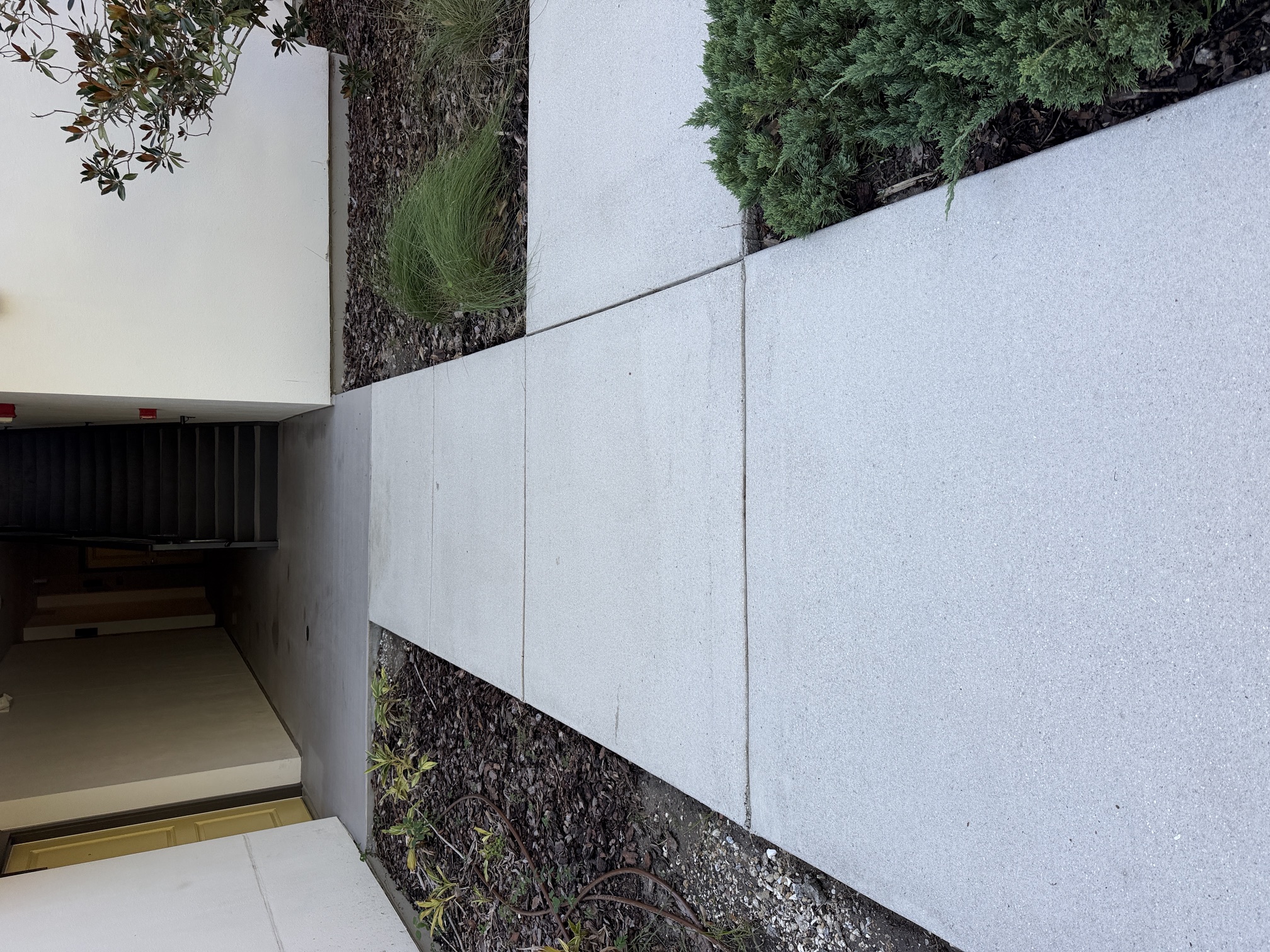 After photo of a clean walkway leading to a stairwell at an apartment community in Largo, FL