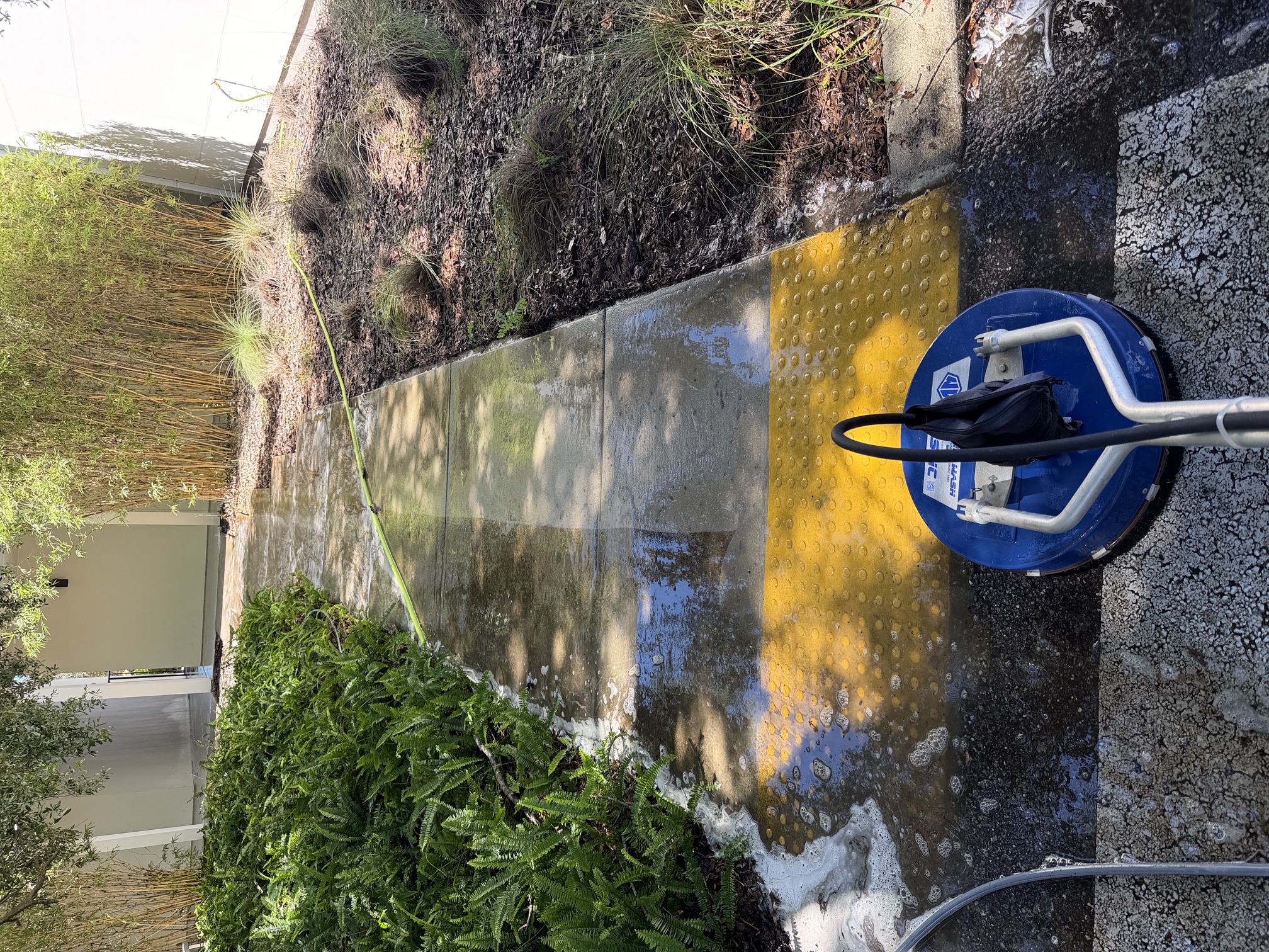 Before photo of a dirty apartment community walkway in Largo, FL