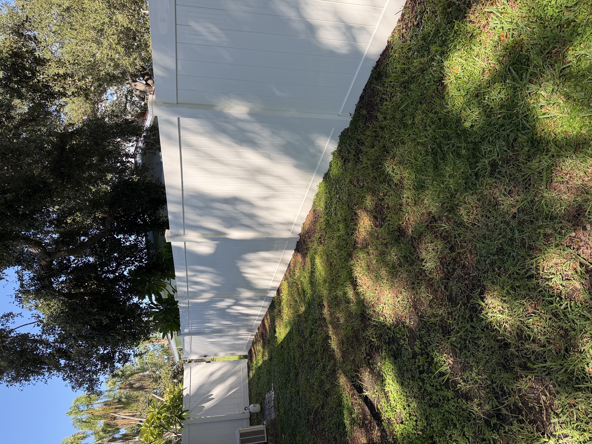 After photo of a clean white vinyl privacy fence in Largo, FL