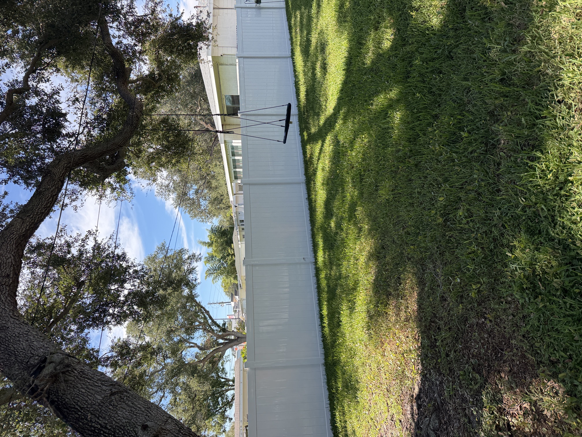 After photo of a clean white vinyl privacy fence in Largo, FL