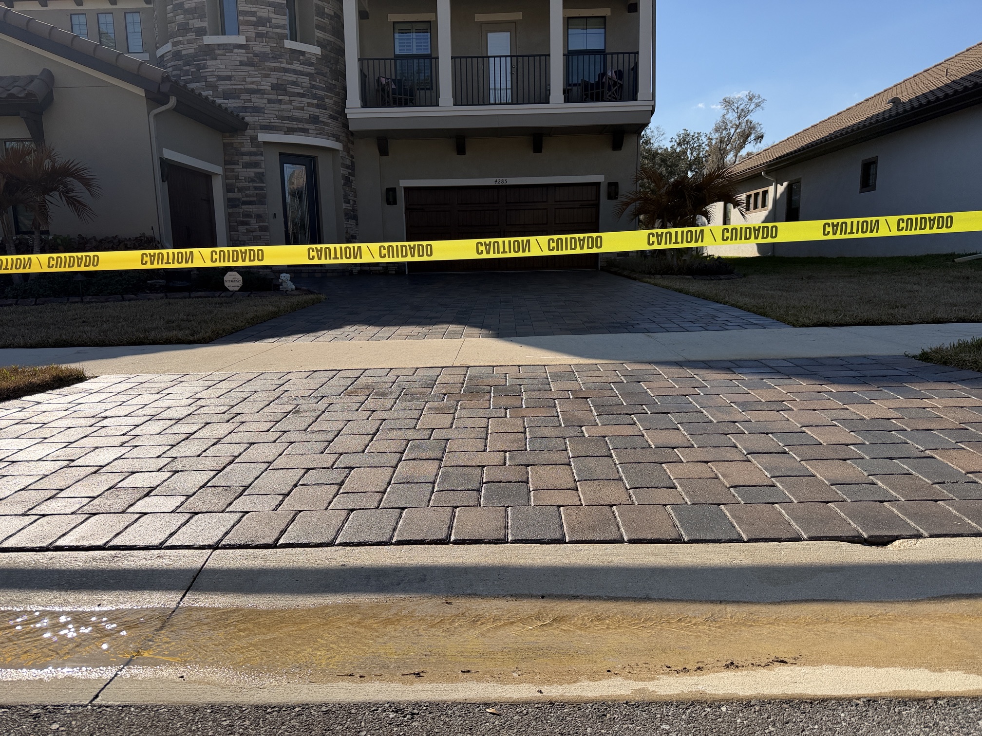 Sealed driveway apron near the sidewalk at the second home in The Sanctuary, Brandon, FL