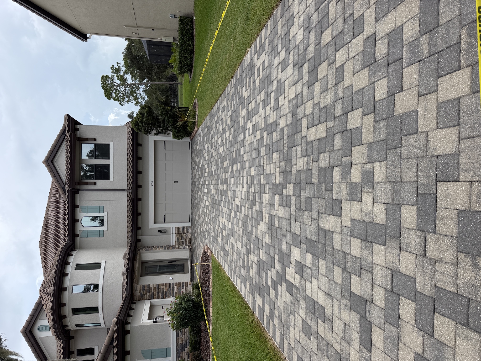 After photo of driveway pavers cleaned and sealed with a satin finish in The Sanctuary, Brandon, FL