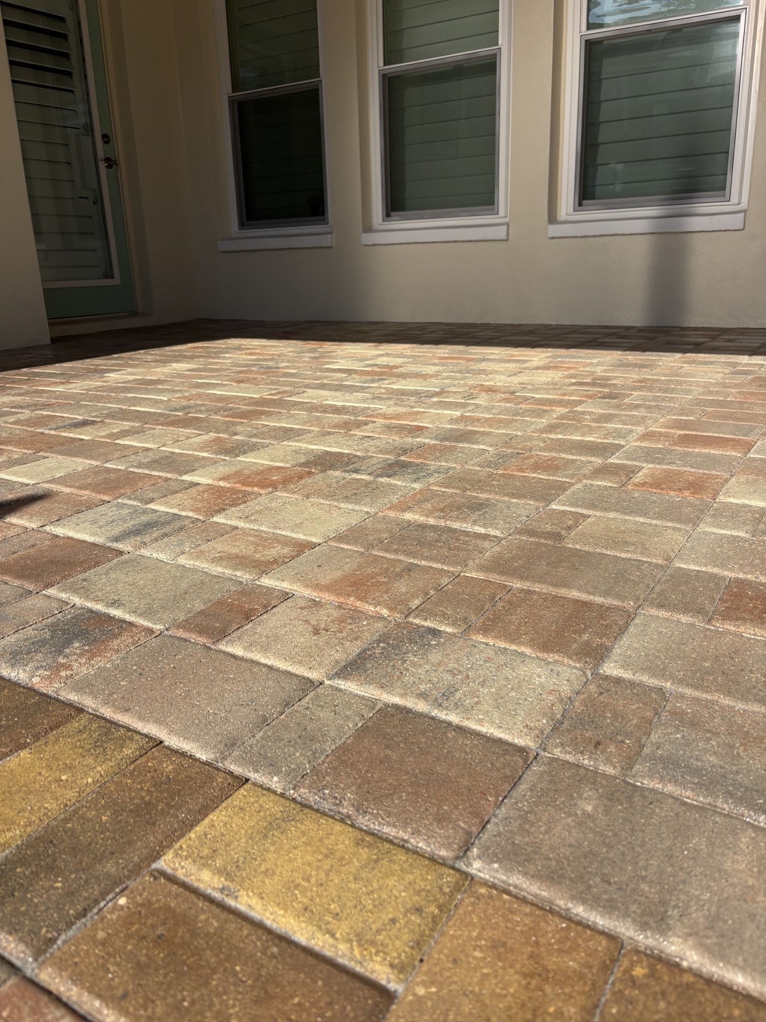 Sealed lanai pavers near the entryway after paver sealing in Seminole, FL